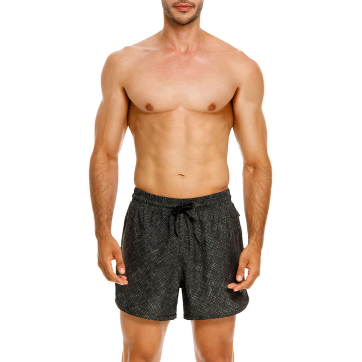 Mundo Unico Motriz running shorts in green – geometric quick-dry performance running shorts