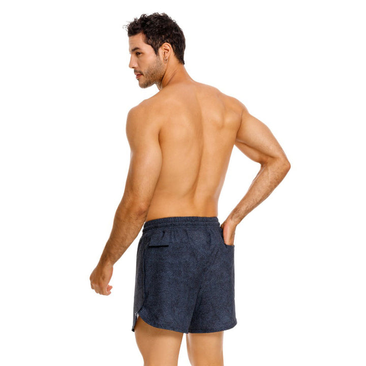 Mundo Unico Tecnica running shorts in blue – geometric Action Tech reflective logo performance shorts
