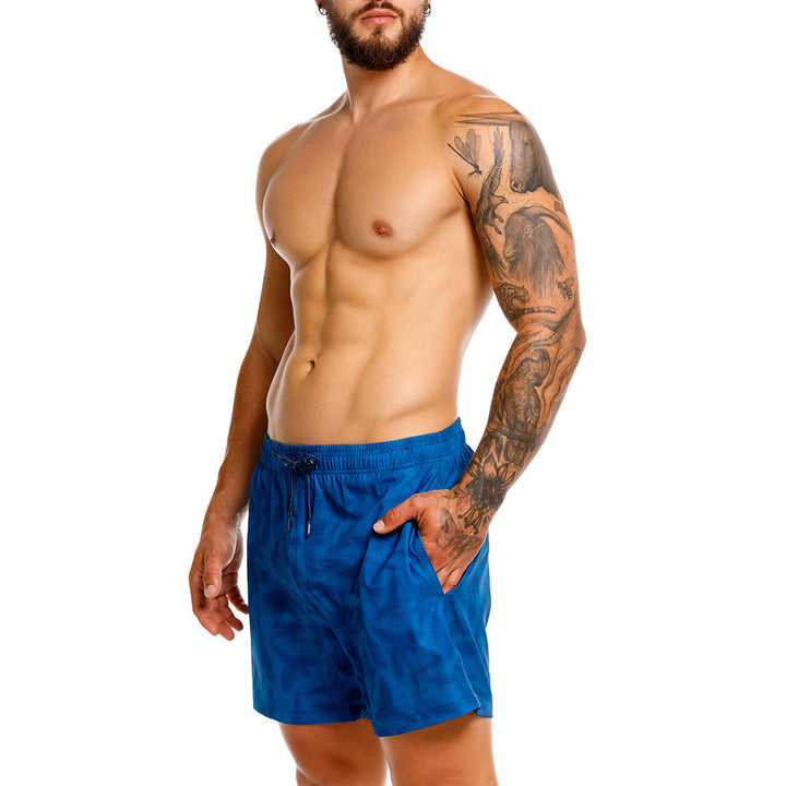 Mundo Unico Guacamaya board shorts in blue – tropical macaw parrot print swim shorts