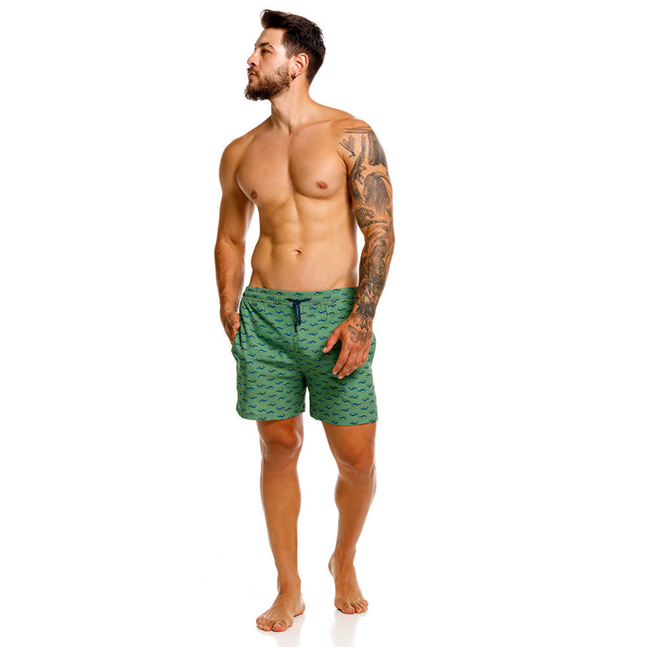 Mundo Unico Mahi Mahi board shorts in green – tropical fish print mid-length swim shorts