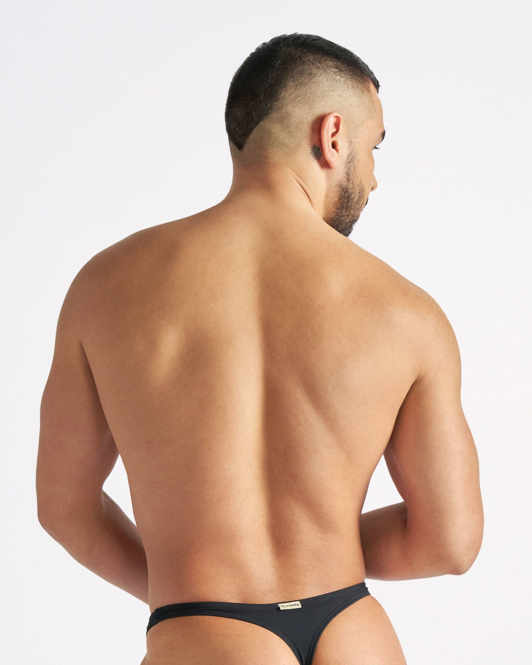 TEAMM8 Arena Swim Thong in black – logo high hip cut fully lined swim thong