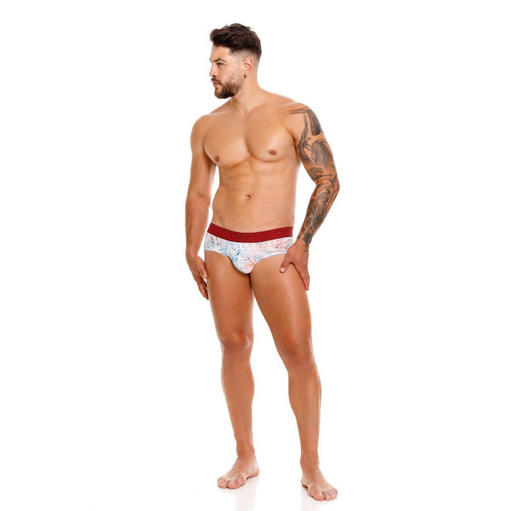 UNICO Rizo men's briefs in white – abstract print stretch underwear with red waistband