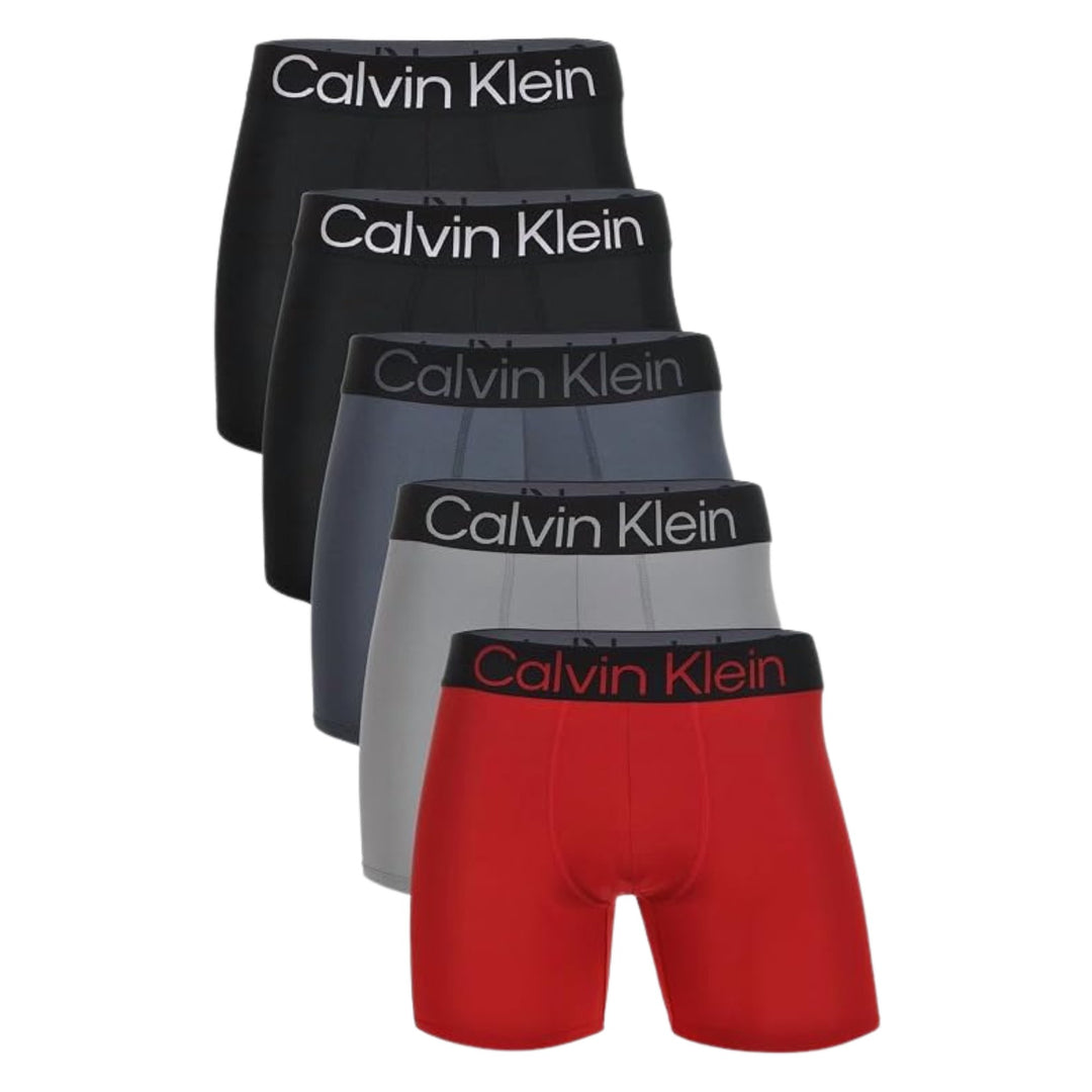 Calvin Klein Bold Logo 5-pack boxer briefs in black, grey, and red, flat lay on white background